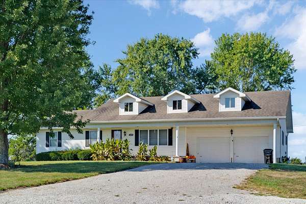 11.4 Acres of Land with Home for Sale in Humansville, Missouri
