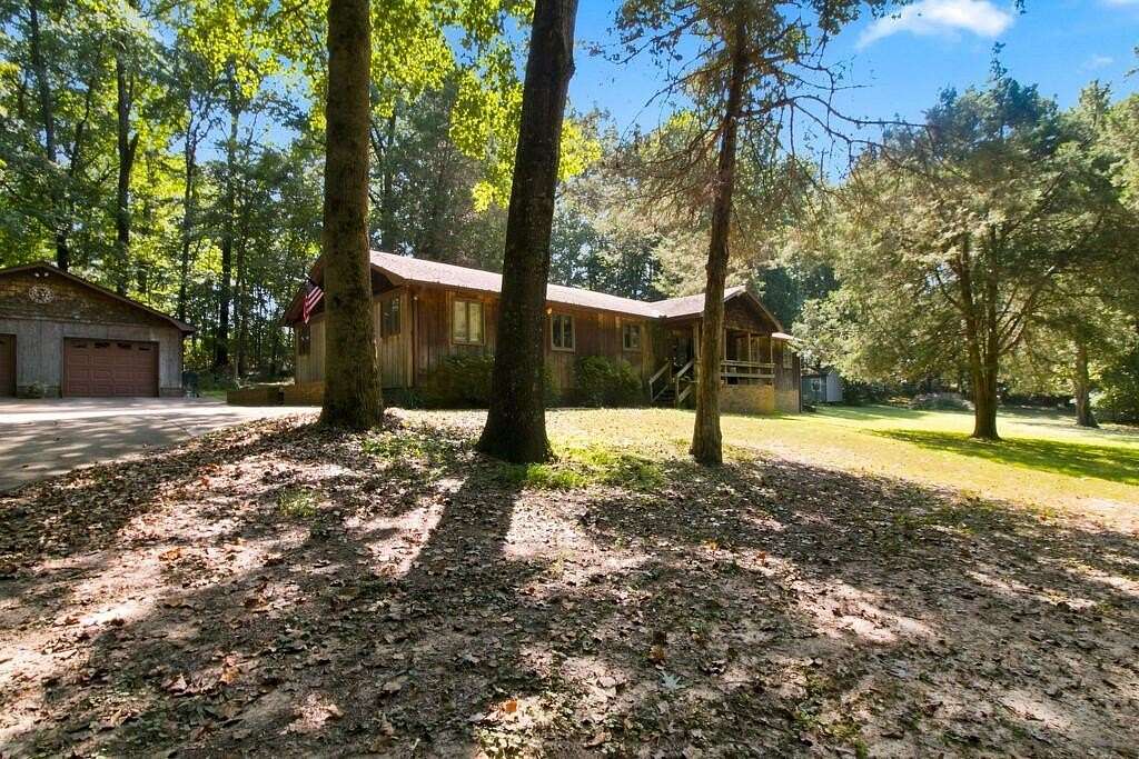 21.1 Acres of Recreational Land with Home for Sale in Paris, Tennessee