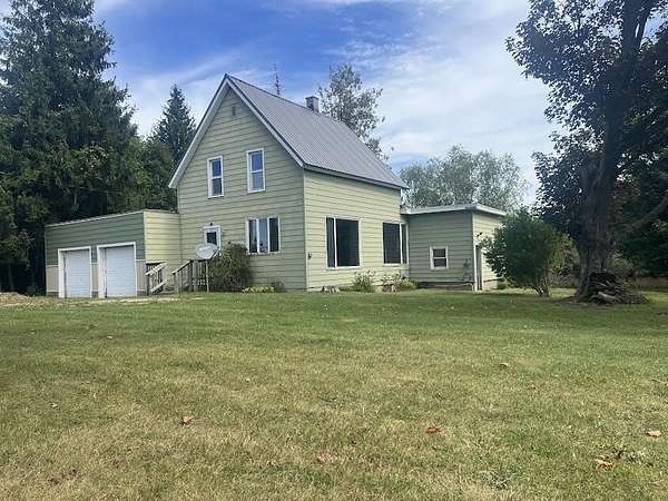 5 Acres of Land with Home for Sale in Scottville, Michigan