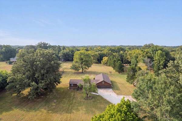 6.9 Acres of Land with Home for Sale in Millington, Tennessee