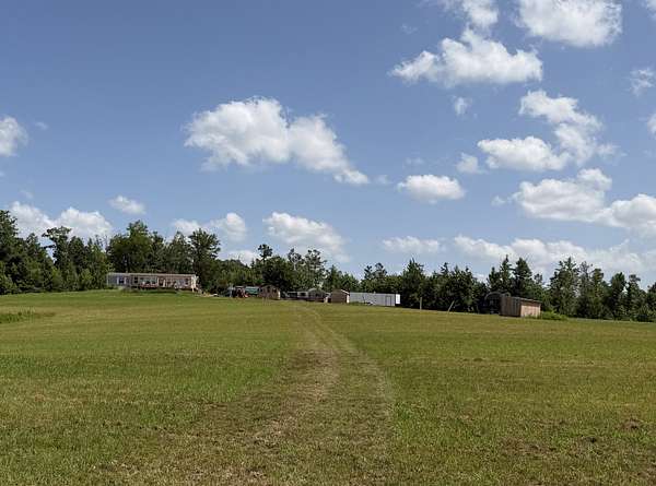 81.7 Acres of Land with Home for Sale in Adamsville, Tennessee