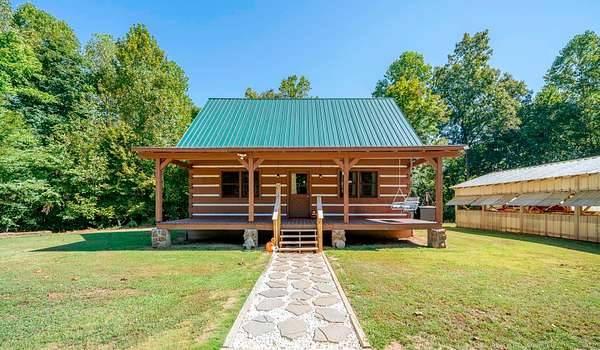 59.7 Acres of Land with Home for Sale in Adamsville, Tennessee