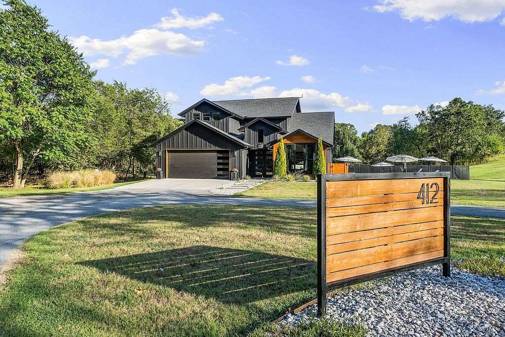 5.77 Acres of Land with Home for Sale in Gentry, Arkansas