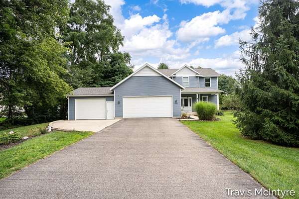 2 Acres of Land with Home for Sale in Rockford, Michigan