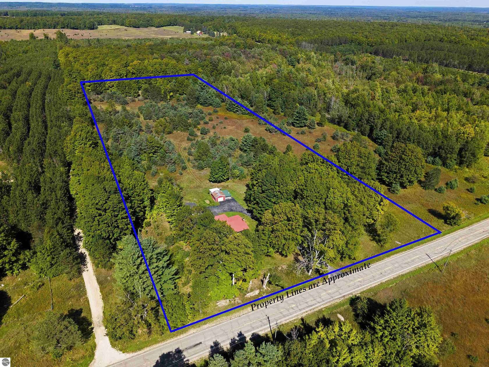 13.5 Acres of Recreational Land with Home for Sale in Fife Lake, Michigan