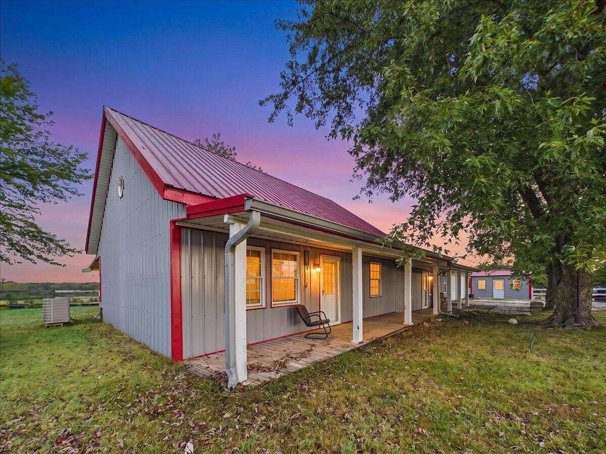 12.3 Acres of Land with Home for Sale in Wheatland, Missouri