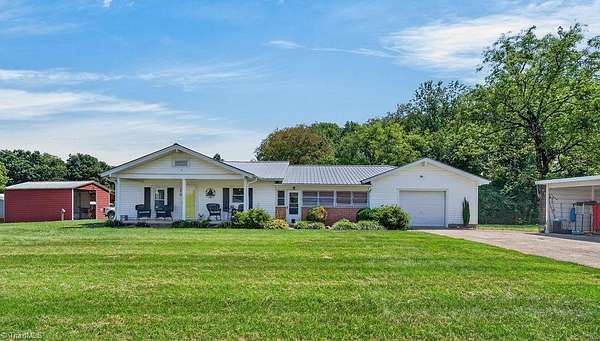 12.1 Acres of Recreational Land with Home for Sale in State Road, North Carolina