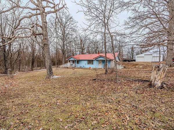 31.1 Acres of Land with Home for Sale in Louisburg, Missouri