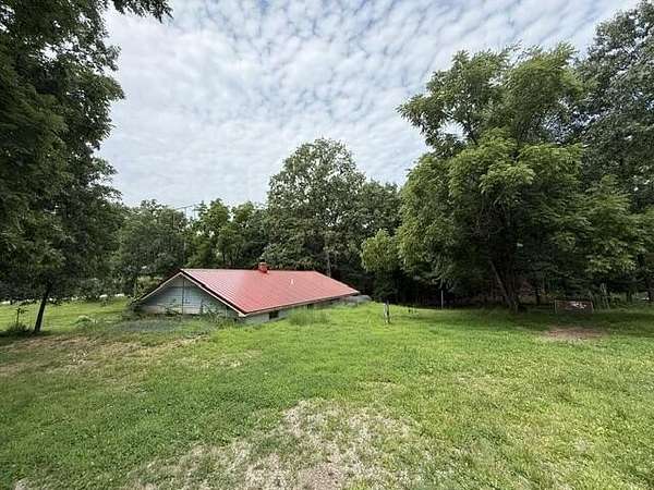 34.1 Acres of Land with Home for Sale in Louisburg, Missouri