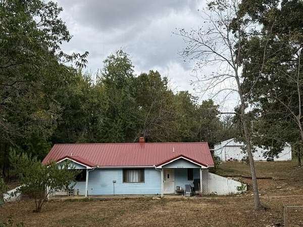 34.1 Acres of Land with Home for Sale in Louisburg, Missouri