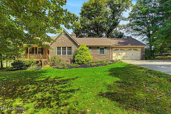 5.6 Acres of Land with Home for Sale in Corryton, Tennessee