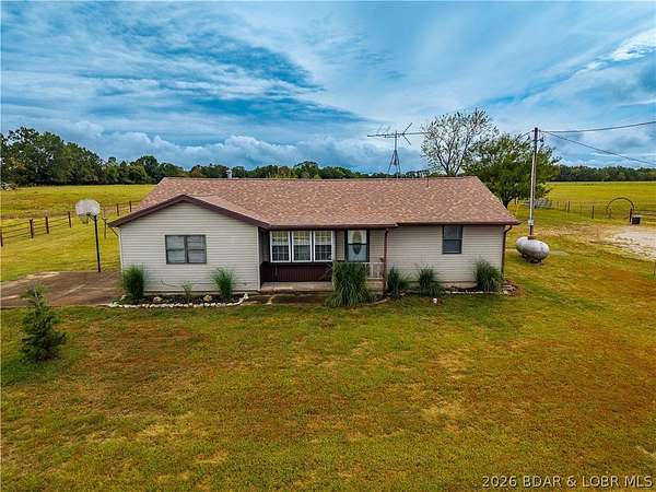 10.7 Acres of Land with Home for Sale in Roach, Missouri