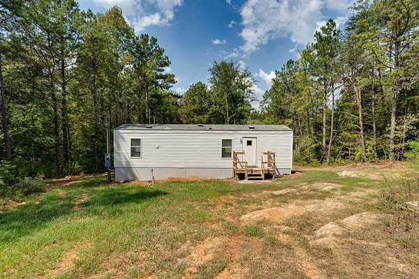 5 Acres of Land with Home for Sale in Oldfort, Tennessee