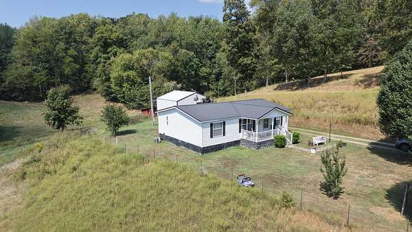 9.4 Acres of Land with Home for Sale in Westmoreland, Tennessee