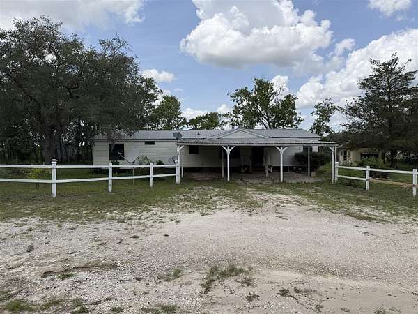 10 Acres of Land with Home for Auction in Dunnellon, Florida