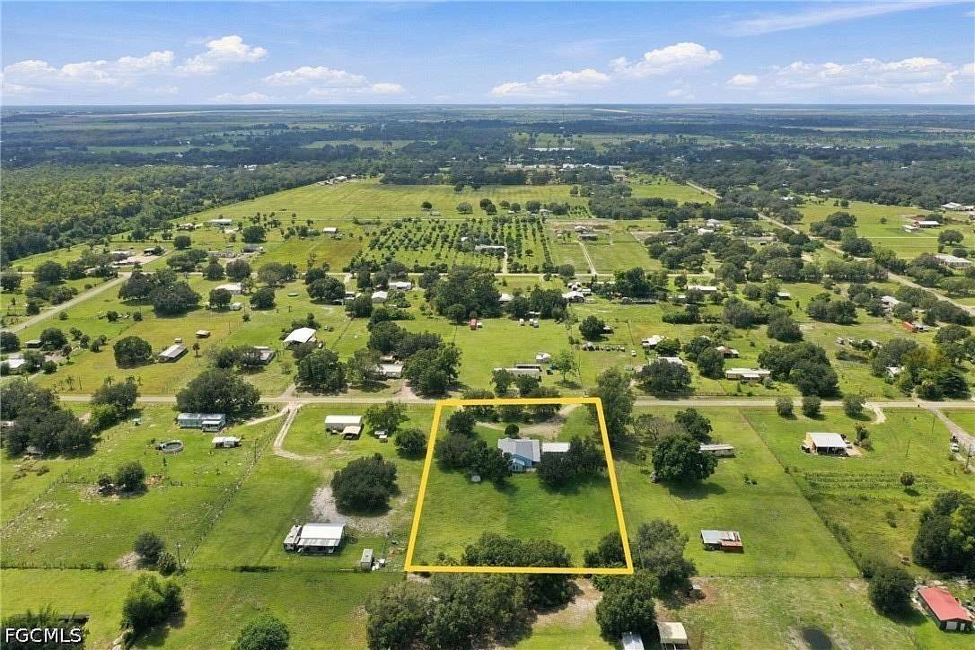 1.86 Acres of Land with Home for Sale in Fort Denaud, Florida