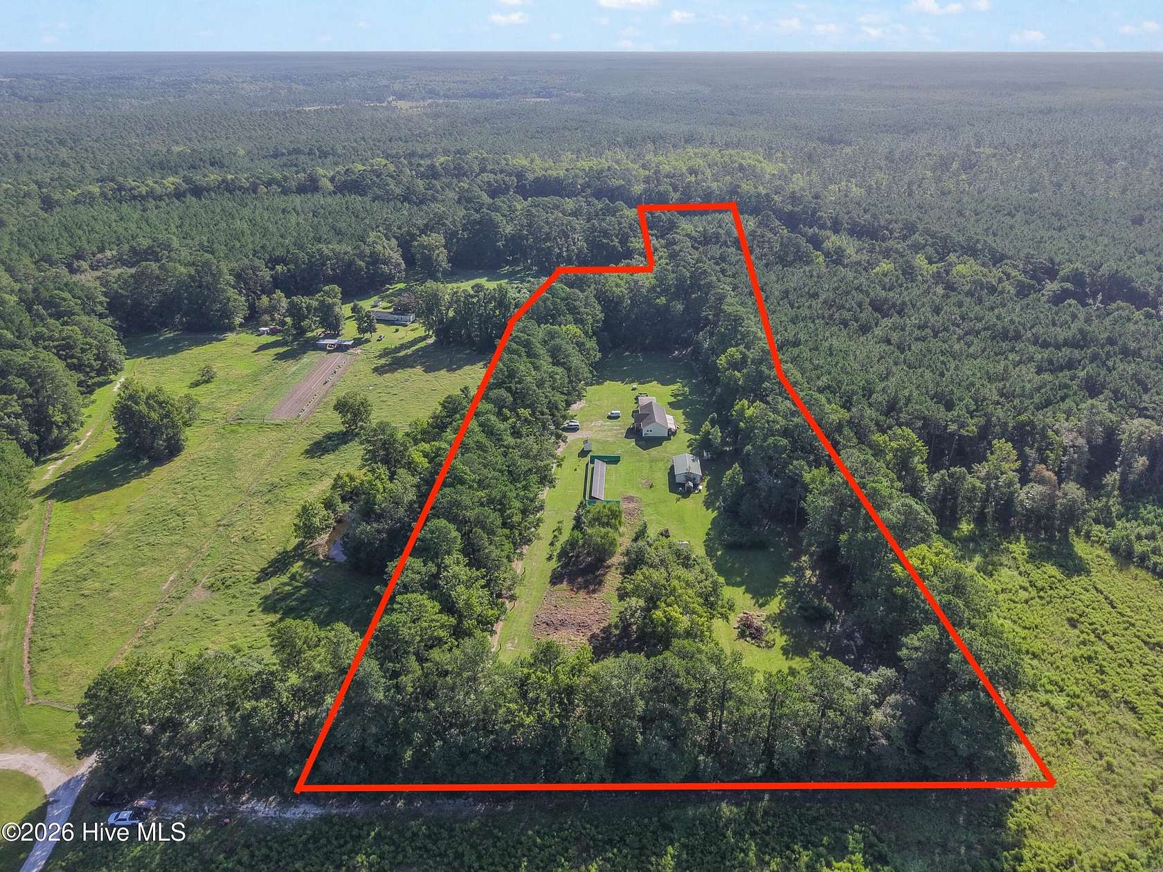 6.88 Acres of Land with Home for Sale in Bolivia, North Carolina
