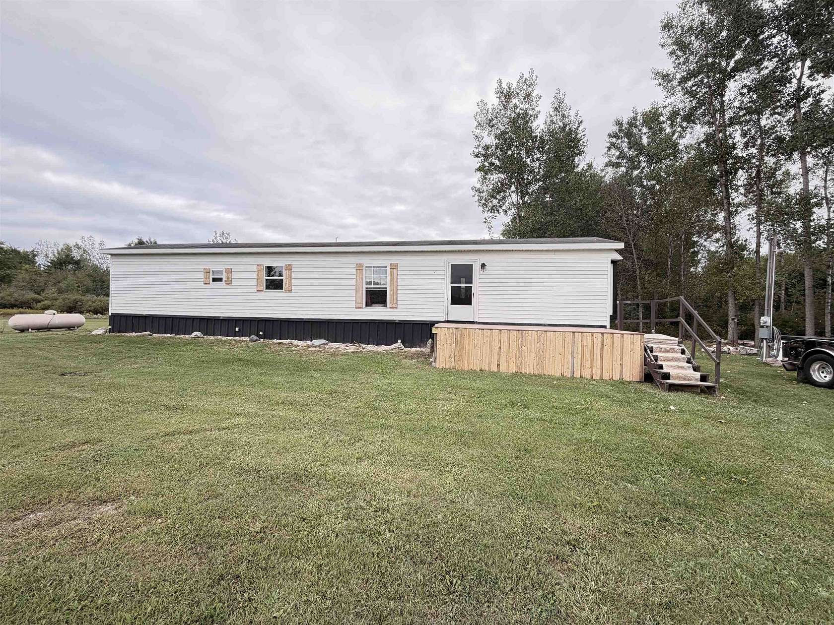 5 Acres of Land with Home for Sale in Beaverton, Michigan