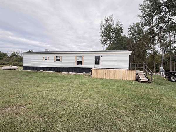 5 Acres of Land with Home for Sale in Beaverton, Michigan