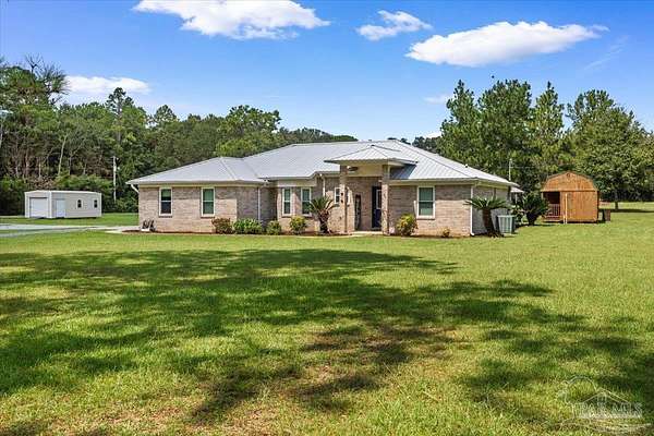 2 Acres of Land with Home for Sale in Pace, Florida