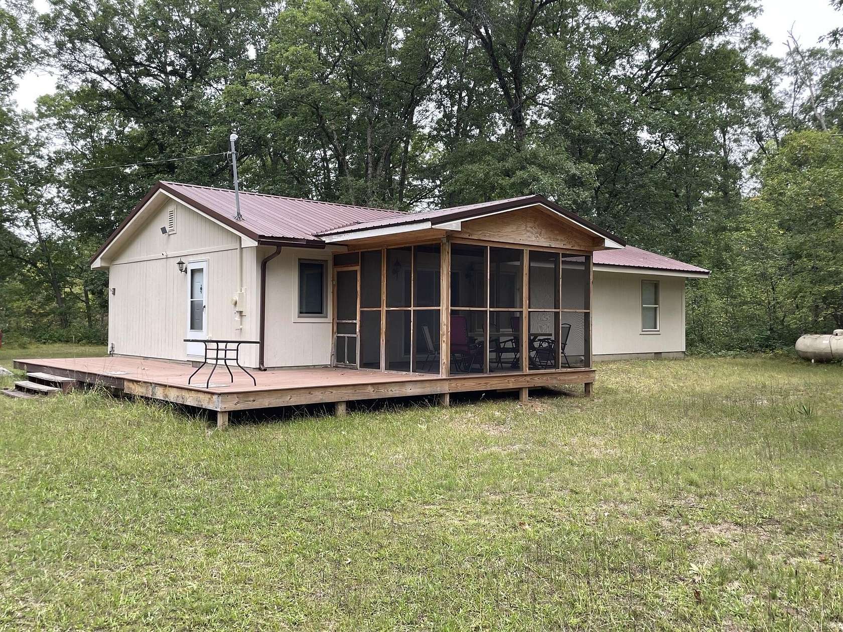 10 Acres of Recreational Land with Home for Sale in Irons, Michigan