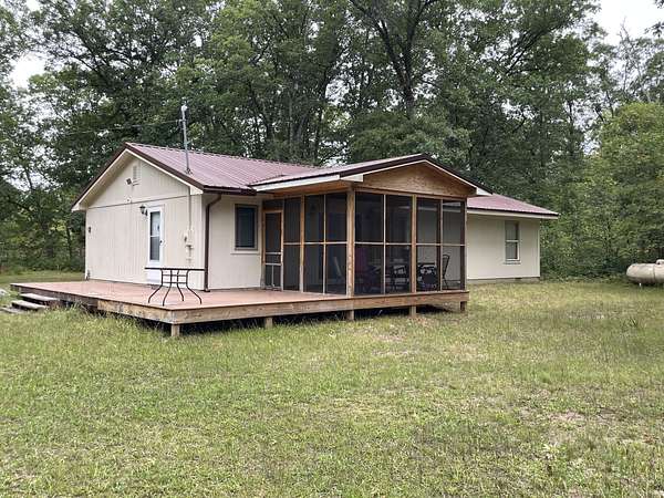 10 Acres of Recreational Land with Home for Sale in Irons, Michigan