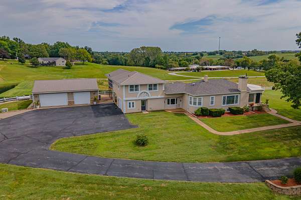 14.3 Acres of Recreational Land with Home for Sale in Glasgow, Missouri