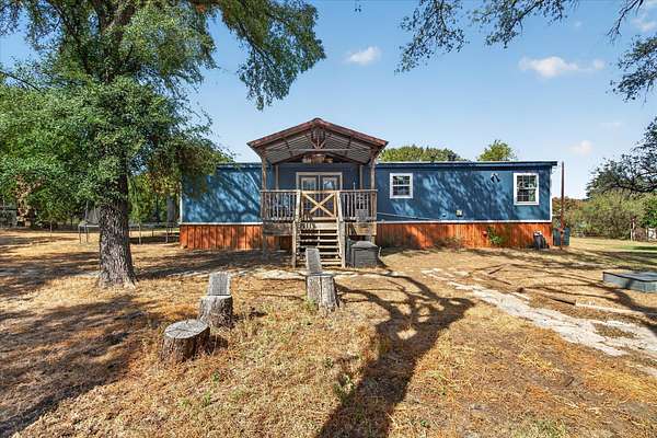 6.9 Acres of Land with Home for Sale in Granbury, Texas