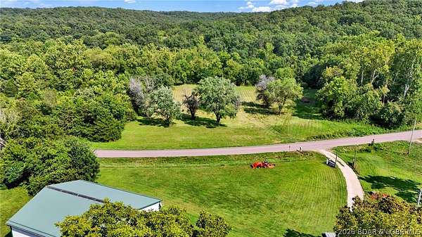 90 Acres of Land with Home for Sale in Versailles, Missouri