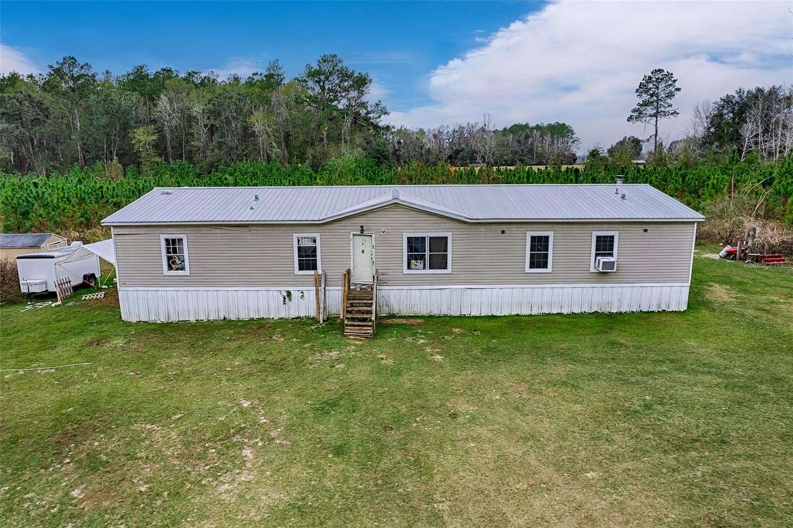 13.2 Acres of Recreational Land with Home for Sale in Lake City, Florida