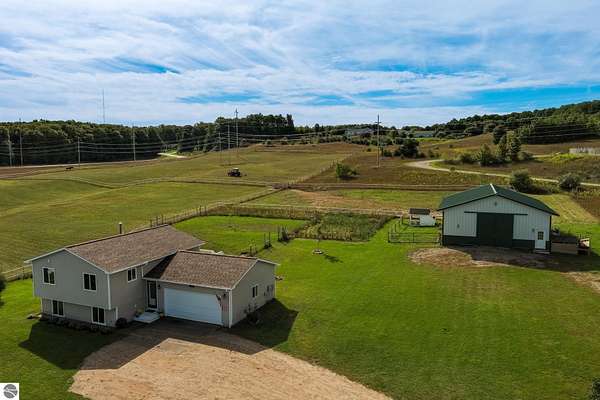 10 Acres of Land with Home for Sale in Cedar, Michigan