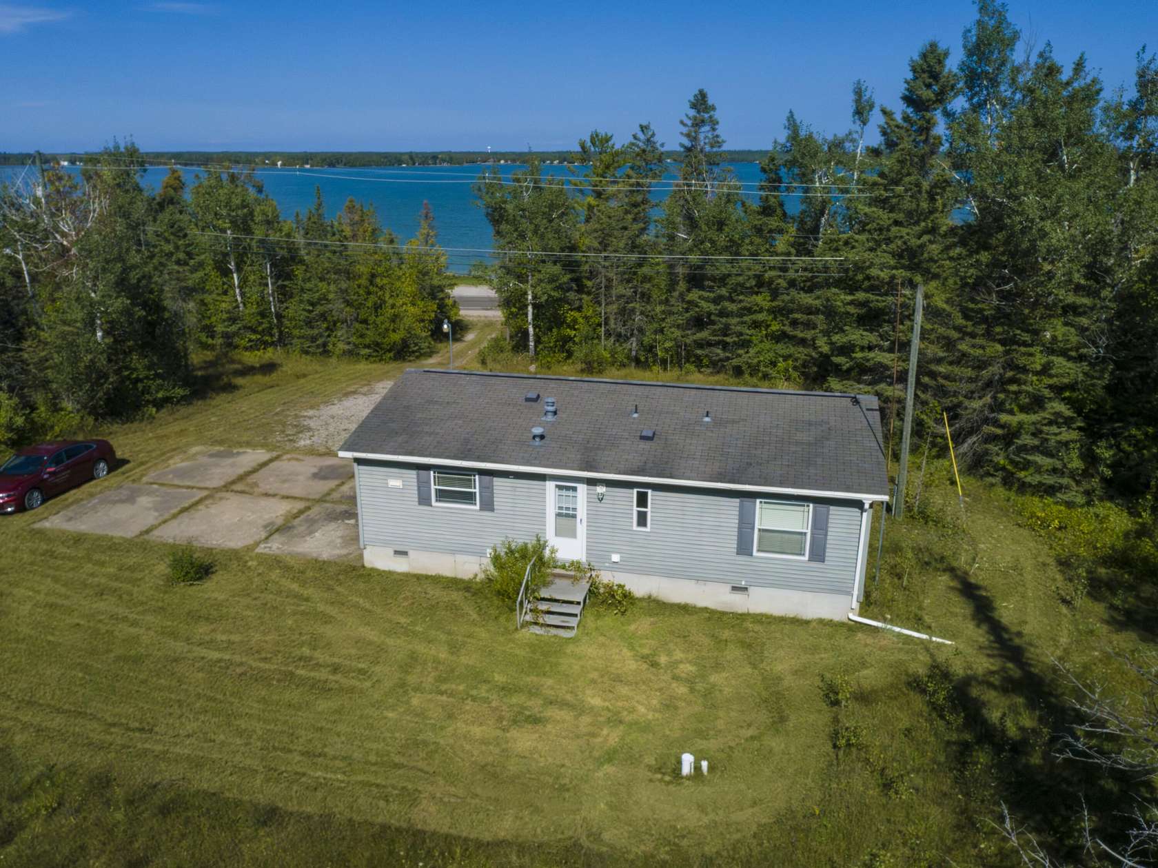 76 Acres of Recreational Land with Home for Sale in Presque Isle, Michigan