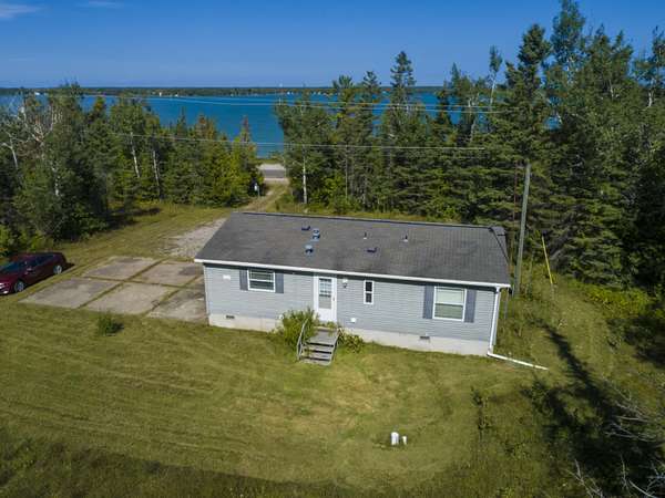 76 Acres of Recreational Land with Home for Sale in Presque Isle, Michigan