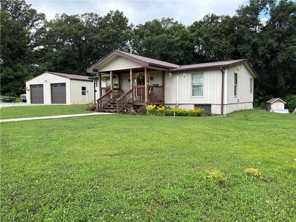9.68 Acres of Land with Home for Sale in Edgerton, Missouri