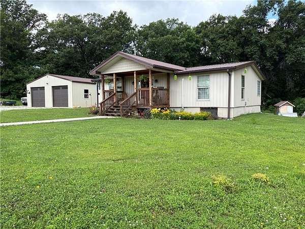 9.68 Acres of Land with Home for Sale in Edgerton, Missouri