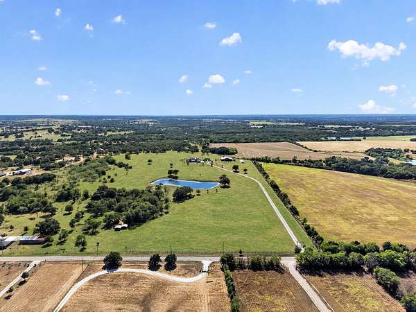 41.7 Acres of Agricultural Land with Home for Sale in Grandview, Texas