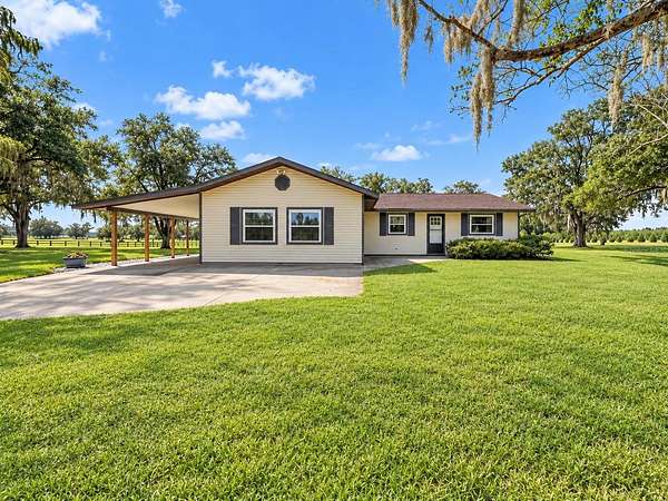 9.64 Acres of Land with Home for Sale in Morriston, Florida