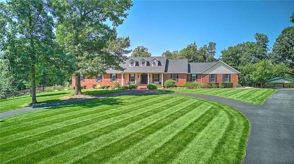 7 Acres of Land with Home for Sale in Rogers, Arkansas