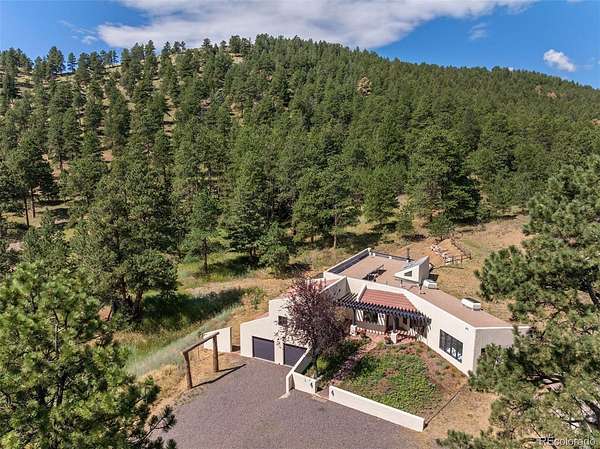 5.12 Acres of Land with Home for Sale in Evergreen, Colorado