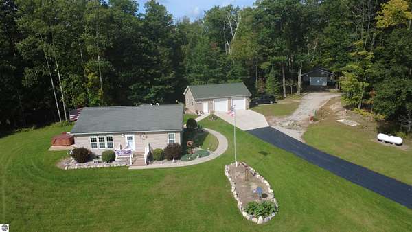 5.34 Acres of Land with Home for Sale in Lupton, Michigan
