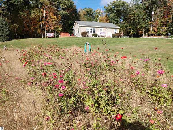 5.34 Acres of Land with Home for Sale in Lupton, Michigan