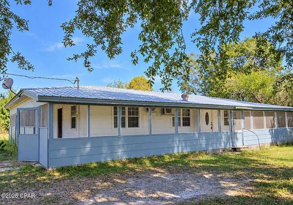 2.17 Acres of Land with Home for Sale in Altha, Florida