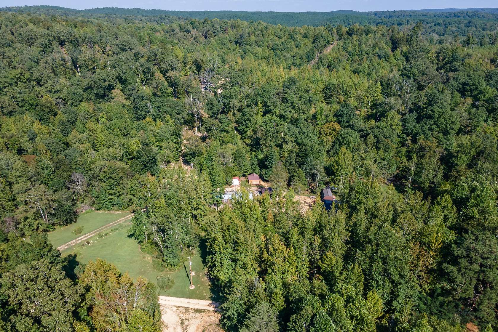 45.8 Acres of Recreational Land with Home for Sale in Lobelville, Tennessee