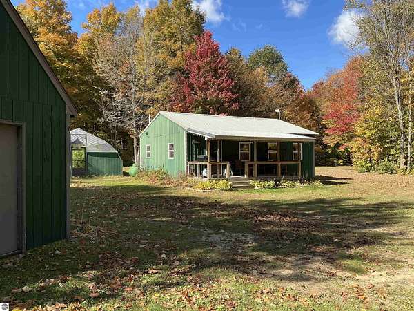10 Acres of Recreational Land with Home for Sale in Mancelona, Michigan