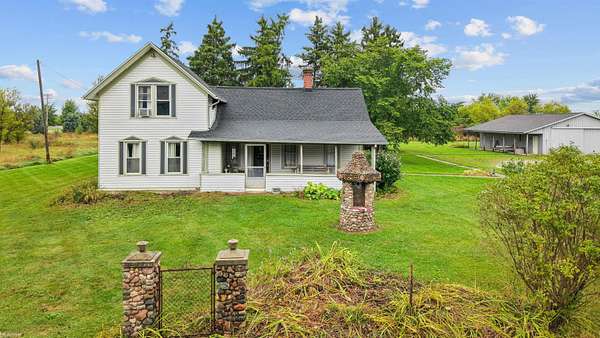 4.12 Acres of Land with Home for Sale in Riley Township, Michigan