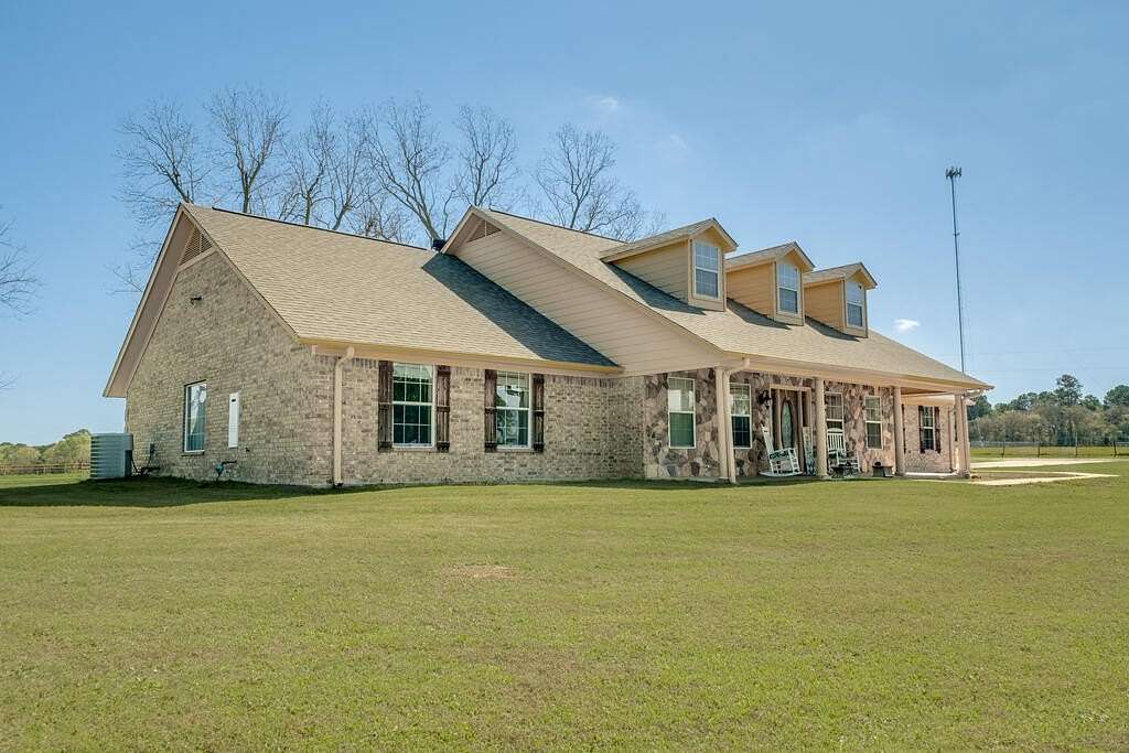 5.6 Acres of Land with Home for Sale in Elkhart, Texas