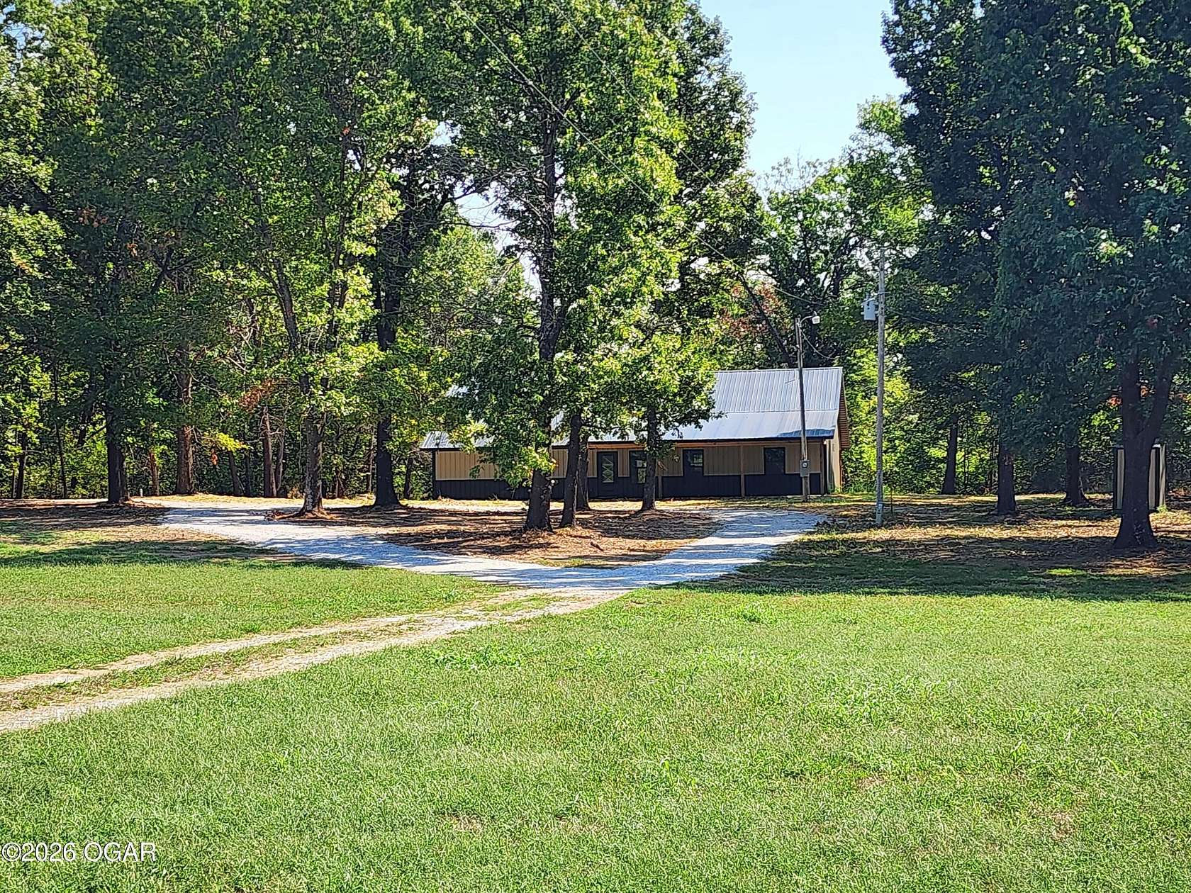 9.77 Acres of Land with Home for Sale in Reeds, Missouri