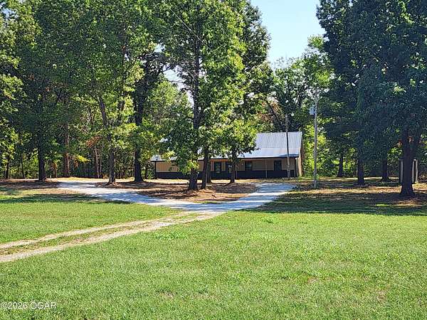 9.77 Acres of Land with Home for Sale in Reeds, Missouri
