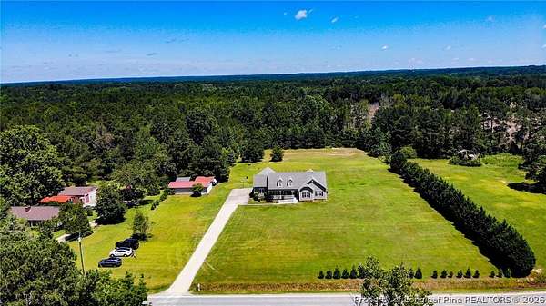 7.66 Acres of Land with Home for Sale in Lillington, North Carolina