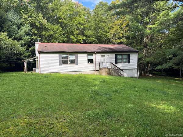 1.63 Acres of Land with Home for Sale in Swan Lake, New York